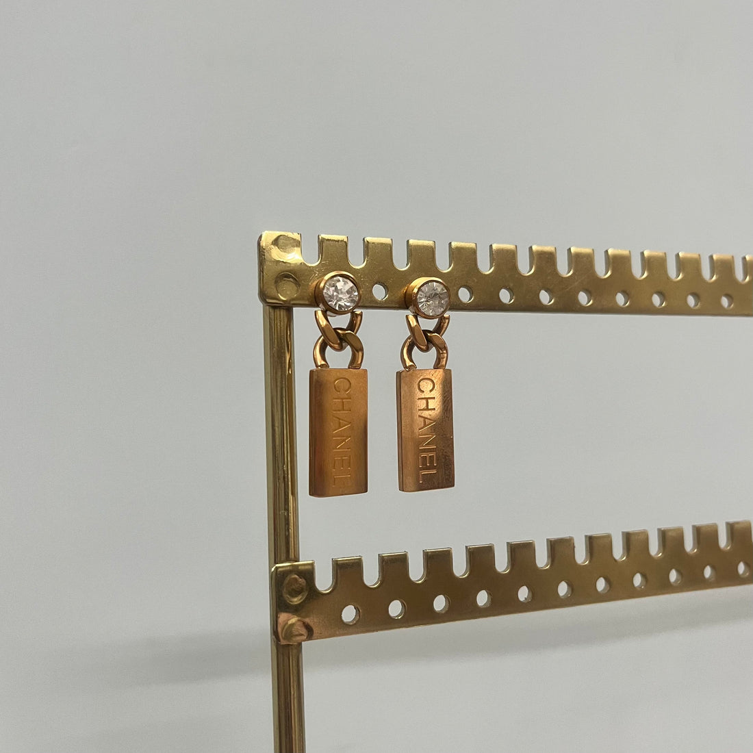 CHANNEL ROSE GOLD TONE EARRINGS