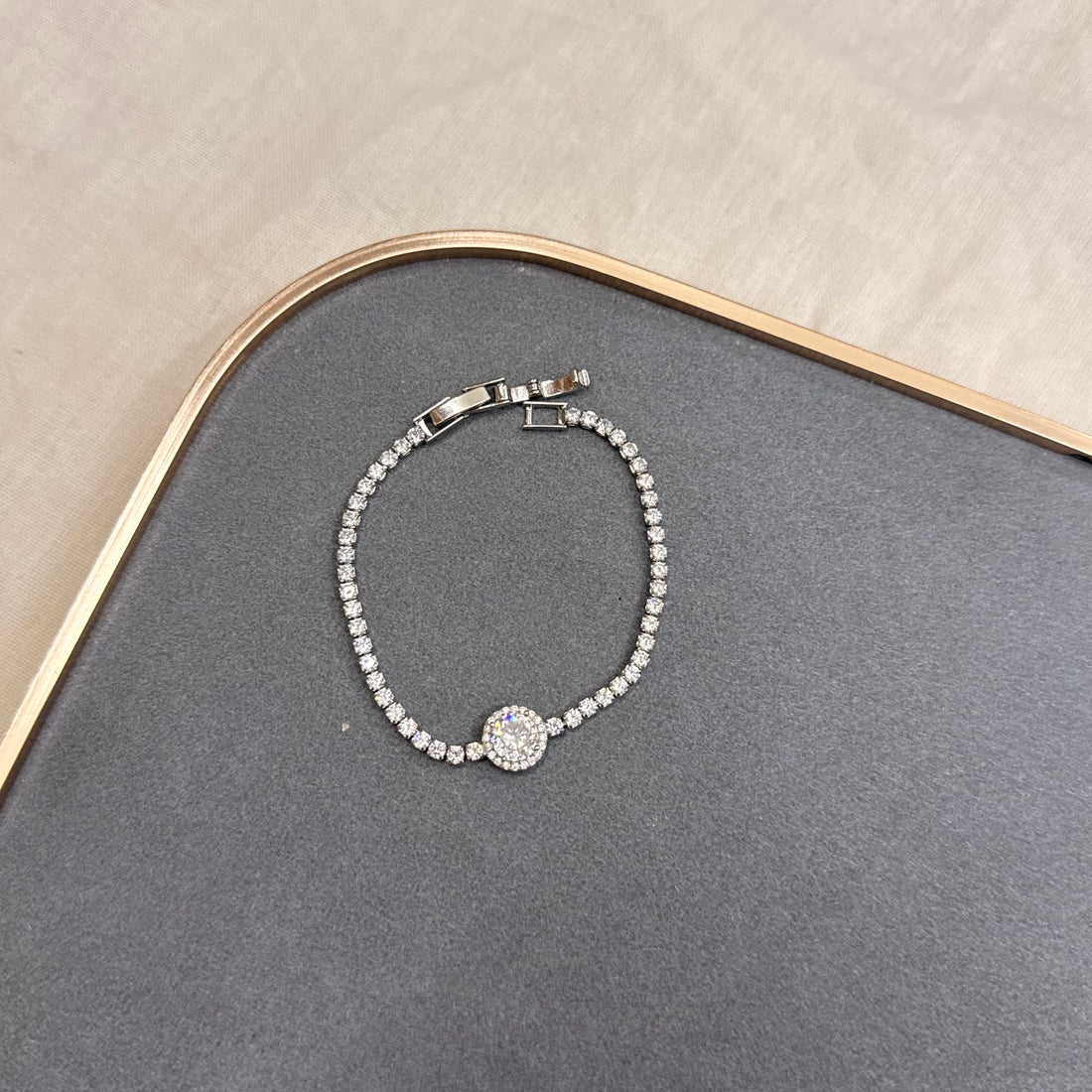 STONE-STUDDED ROUND TENNIS BRACELET