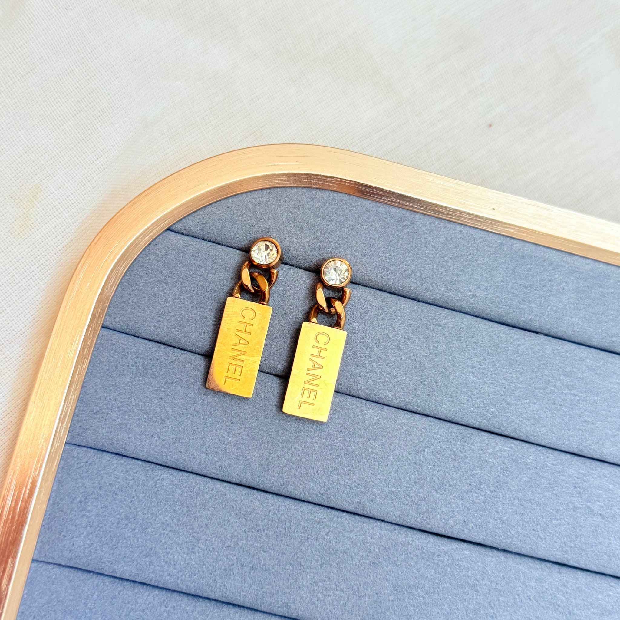 CHANNEL ROSE GOLD TONE EARRINGS